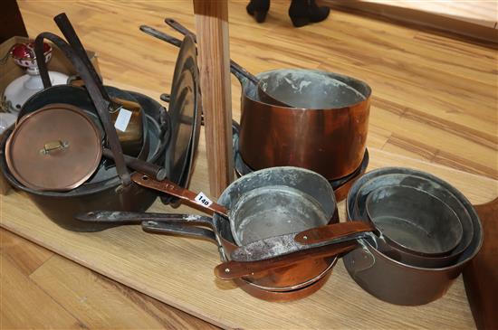 A collection of copper pans, pewter plates etc